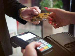 Man holding credit card, illustrating easy access to credit facilities for financial flexibility and convenience.